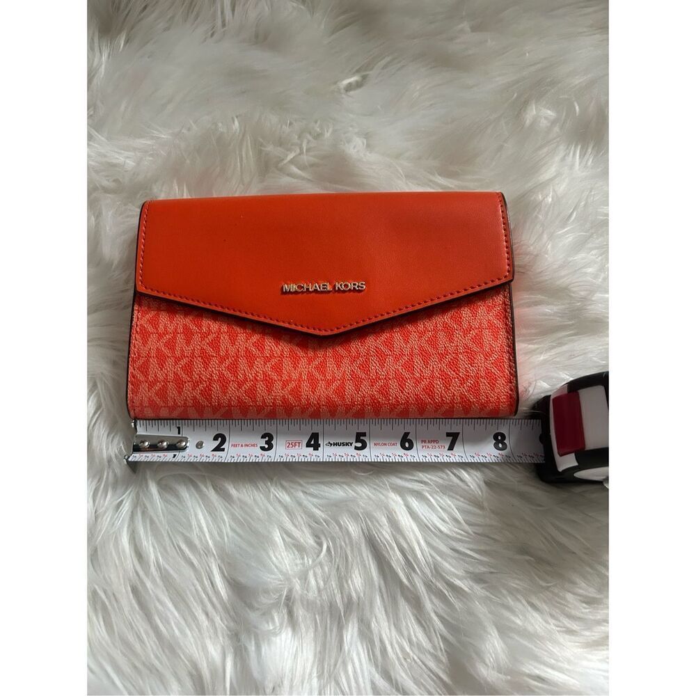 Michael Kors orange clutch no strap 8x5 inches